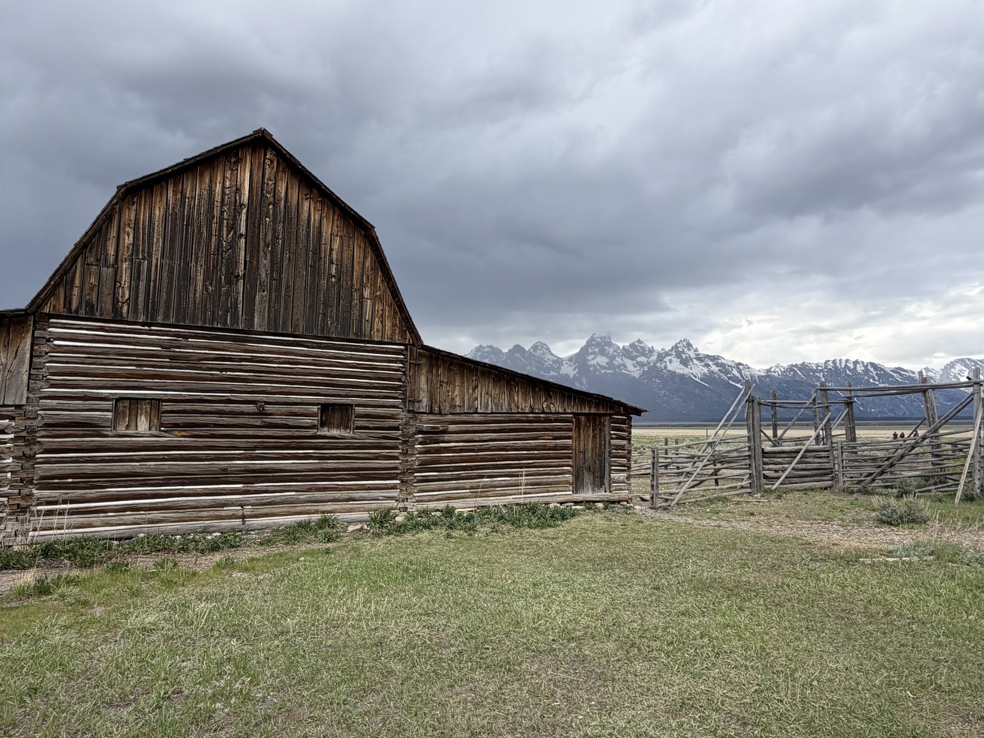 The John Moulton barn on Mormon Row under a gathering storm, Grand Teton National Park